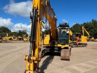 front of a JCB JS220X